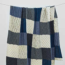 Irisches Wollplaid mit Aran-Strickmuster