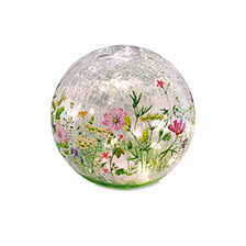 Leuchtende Glaskugel mit Blumenmotiven
